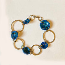 REcycleds Blueish Plastic domes and white metal disc bracelet by Bags to Riches