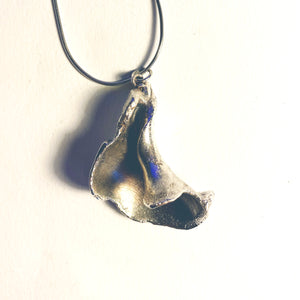 Silvered Electro Formed worn welk on a chain