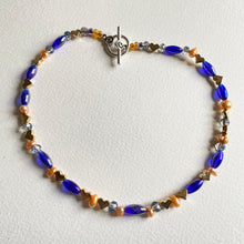 Cobalt blue, orange, crystal and metal heart choker with matching drop earrings by Caroline Salmon