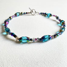 Choker necklace with cut blue glass and rainbow beads and hints of Swarovski crystal beads