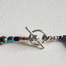 close up of silver plate cute toggle to the cut glass bead and rainbow bead choker