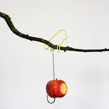 Yellow Wire Bird Feeder with apple on branch
